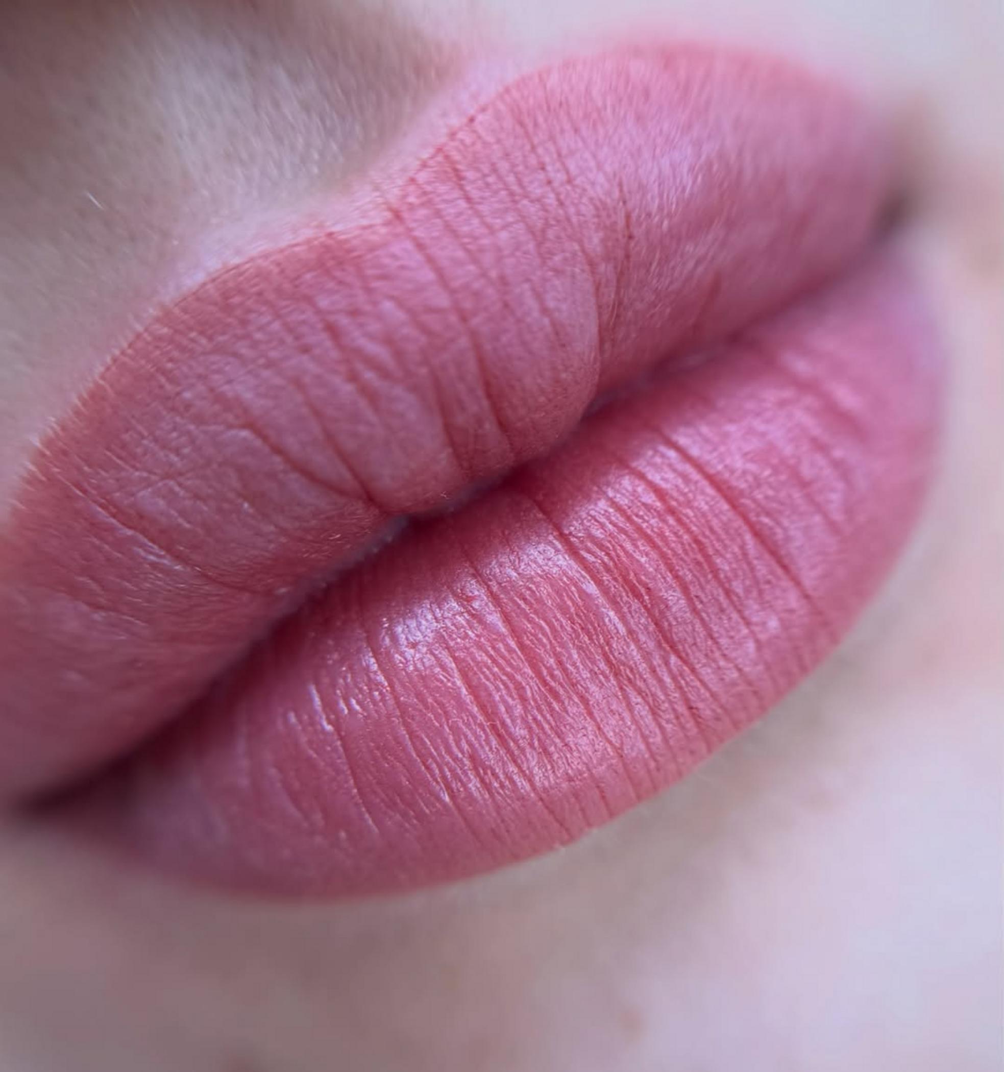 technician applying permanent lipstick
